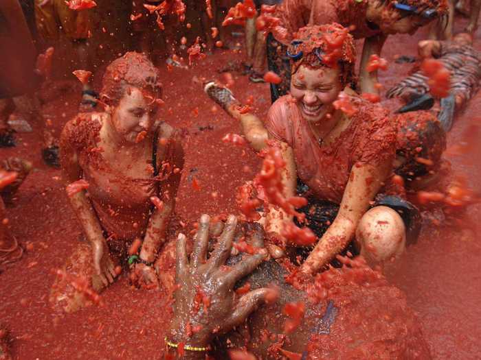 The biggest food fight in the world, La Tomatina attracts around 30,000 people to Buñol, Spain, who come to party and hurl tomatoes at each other every August.