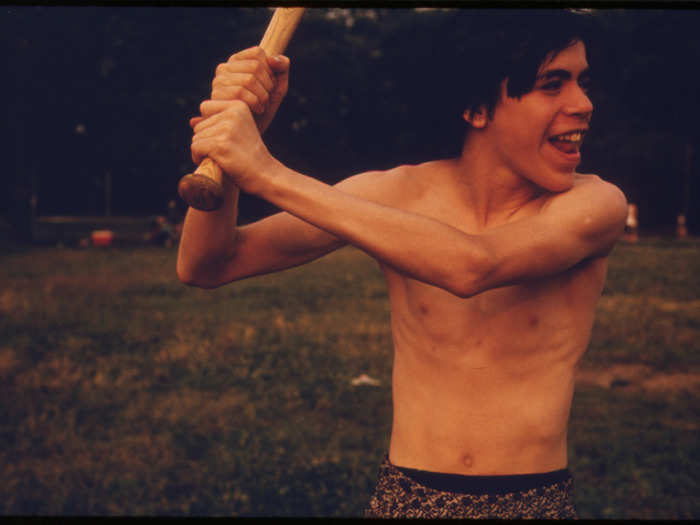 Boy at bat in a softball game in Highland Park, Brooklyn