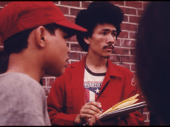 Boy Scout Leader recruiting among children in the Bed-Stuy neighborhood.