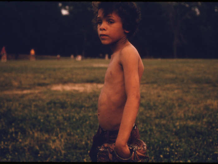 Puerto Rican Boy playing ball in Highland Park, Brooklyn.