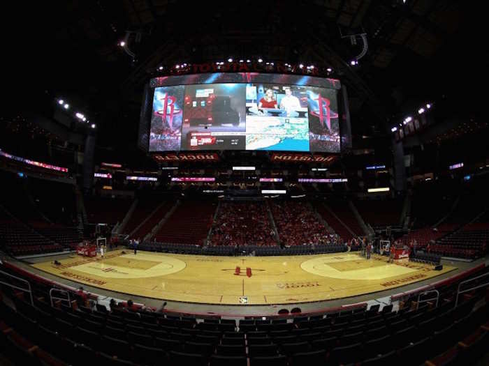 In nearby Houston, fans who had just watched the Houston Rockets play the Golden State Warriors were forced to stay in the Toyota Center arena because of emergency flash flooding, while the video board provided news.