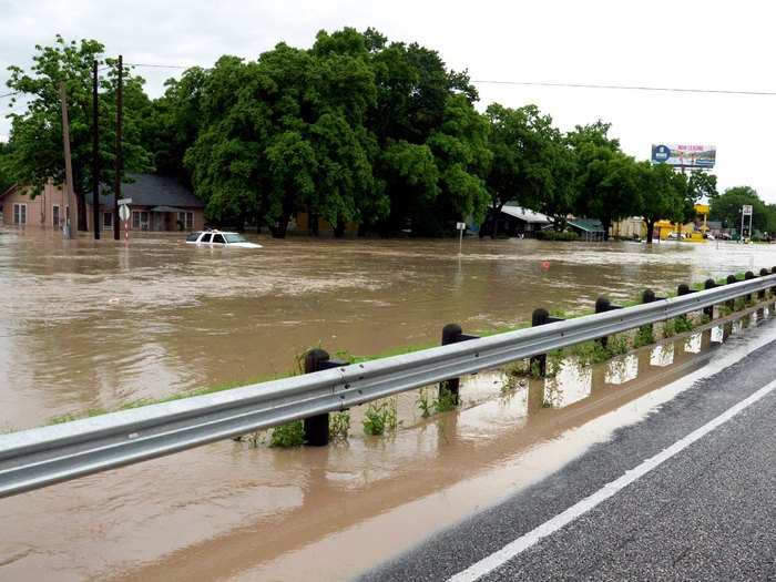 Flood waters covered the roads, businesses, and houses in San Marcos.