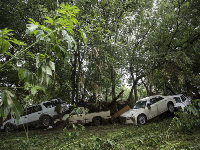 The devastation in San Marcos was everywhere, as is evident by this mass of damaged cars and debris piled up against a line of trees.