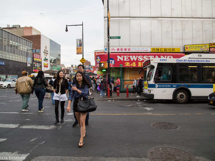 Bodegas, restaurants, cafés, and spas lined Roosevelt Avenue, downtown Flushing