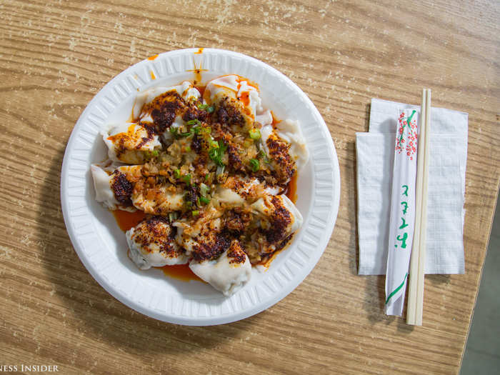 The spicy wantons arrived piping hot. I picked one up with my chopsticks — which was surprisingly easy to do, given the dumplings