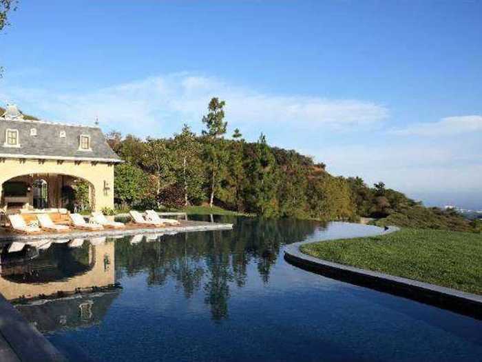 Highlights include a moat, sweeping terraces, and an infinity pool with views of the Pacific Ocean.