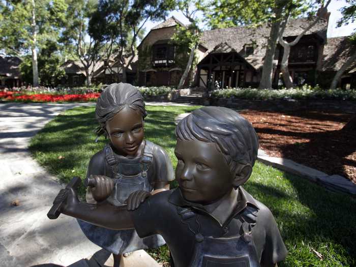 Passing through the gates into the driveway, visitors will see a bronze statue of children playing in front of the main house.