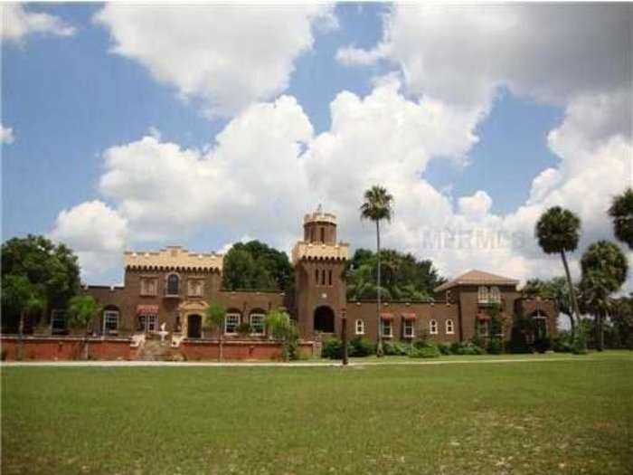 This Spanish-style castle has a two-story library.