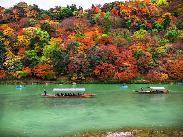 The Oi River runs through the district of Arashiyama in Kyoto and offers boats you can rent to explore its exquisite scenery.