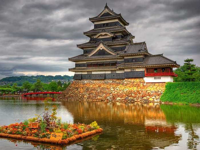 Japan is home to majestic castles like the Matsumoto Castle, which dates back to 1590 and still maintains its original wooden interiors and external stonework.