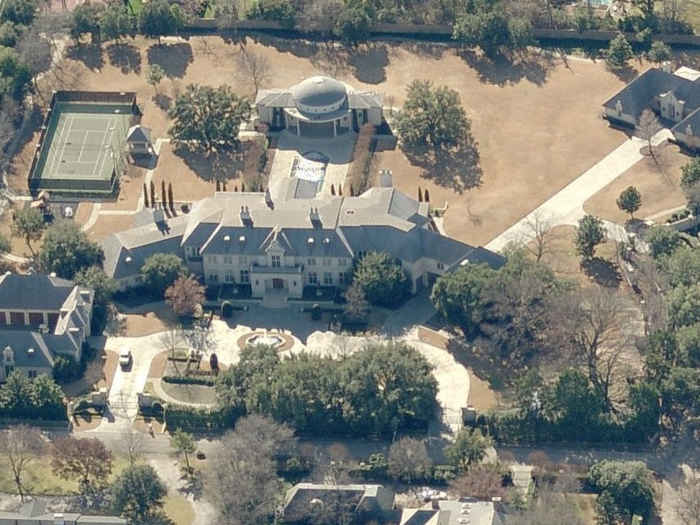 One of the first things he did was buy a mansion worthy of the billionaire title: a 24,000-square-foot home in the Preston Hollow neighborhood of Dallas. Purchased for $15 million in 2000, the house is now worth about $17.3 million, according to Dallas public assessor records.