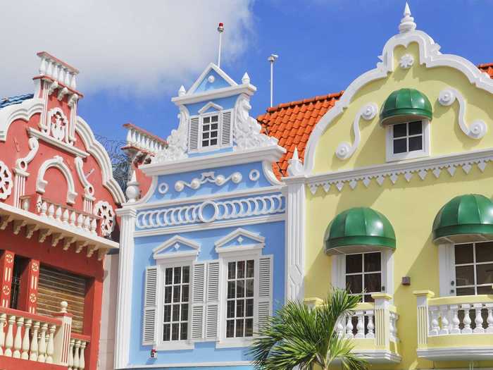 Owned by the Dutch, the Caribbean island of Aruba presents an interesting mix of cultures. Its beaches are straight from a postcard, and its architectures is comprised of quaint Dutch buildings painted in bright tropical pastels. You can