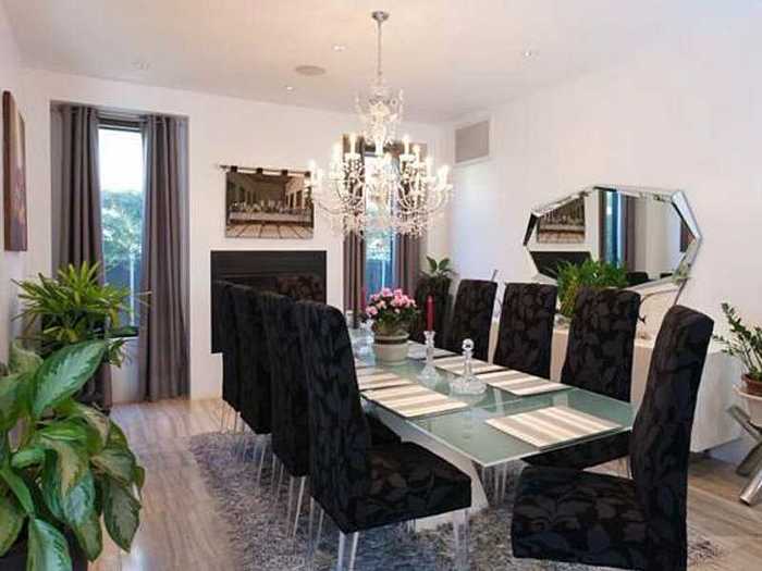 The dining room is best imagined with different chairs and less fake foliage.