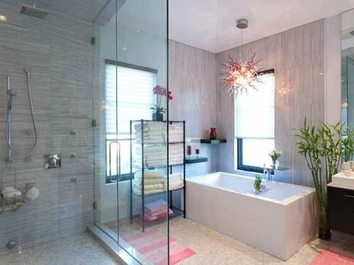 The master suite has a balcony that overlooks the pool and a bathroom with a crazy light fixture that you can stare at while you soak in the tub.