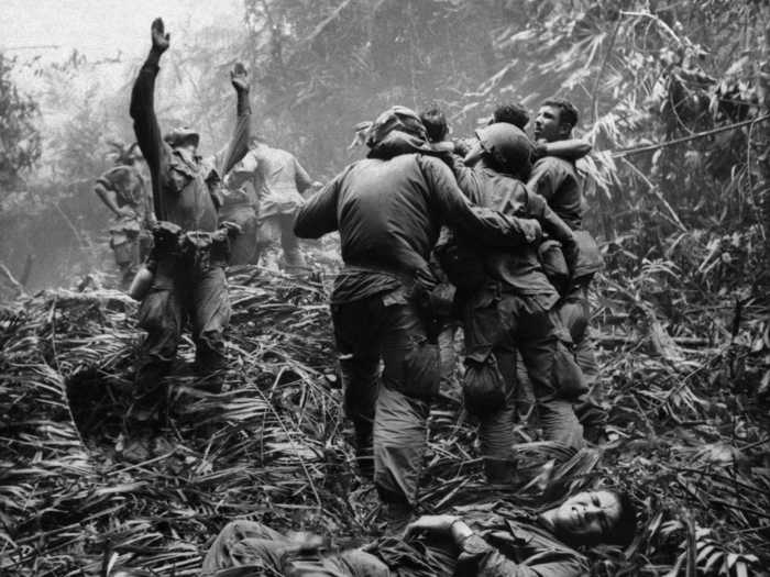 Here, a first sergeant guides a medevac helicopter through the jungles of Vietnam.