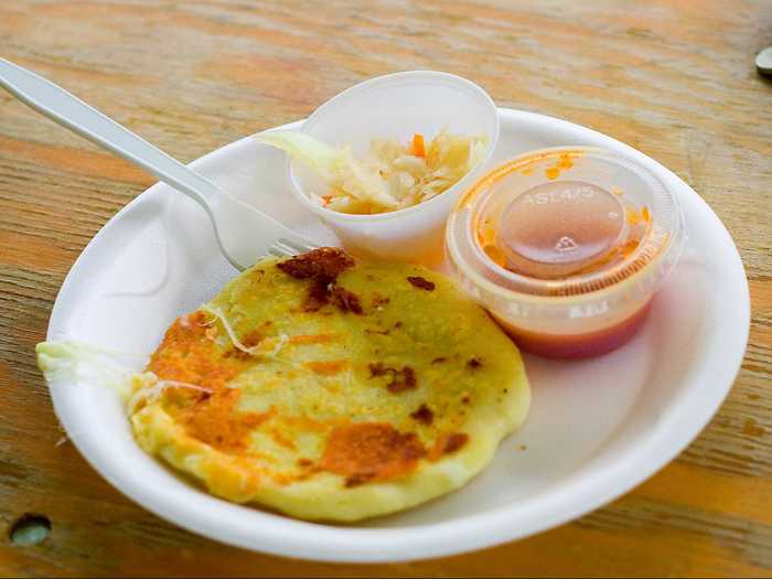 In El Salvador, corn tortillas are stuffed with refried red beans, cheese, and salty pork rinds to make pupusas.