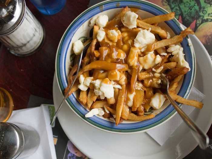 Poutine, found in Quebec, Canada, consists of French fries smothered in a salty brown gravy and fresh cheese curds.