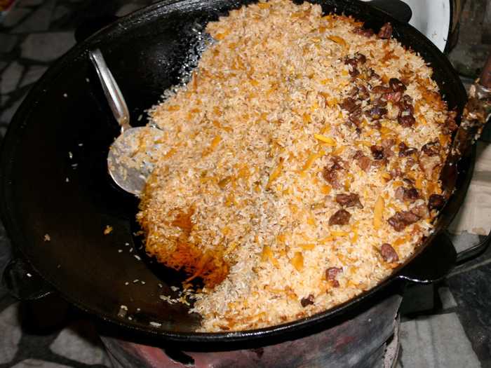 Palov (plov or pilaf) is a popular rice dish in Uzbekistan made of meat, onion, carrots, rice and variations including chickpeas and raisins. It’s usually served on a large plate for sharing.