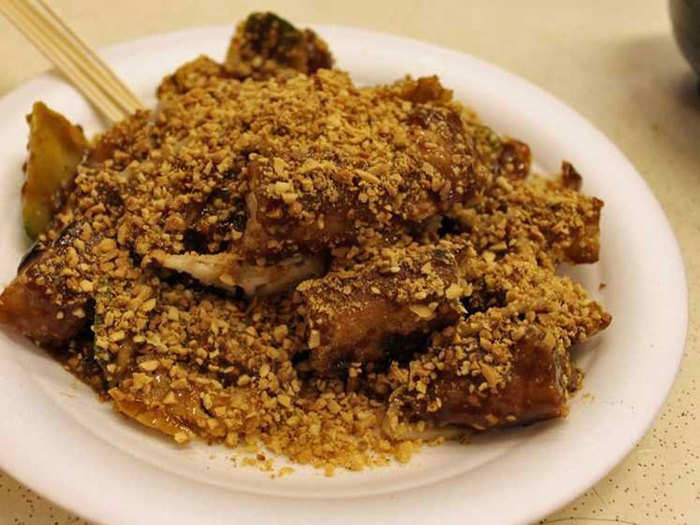 In Singapore, Rojak is made with tofu, prawns, eggs, and potatoes served in a sweet and spicy chili sauce. Sometimes, Rojak will come with fruit as well.