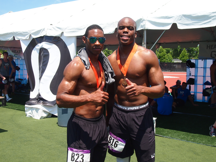 Travis Melvin of Wells Fargo and Jaiye Falusi of Citi with their finisher medals