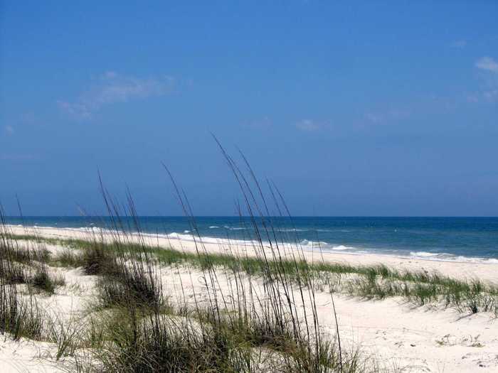 11. St. George Island State Park sits in Florida’s panhandle and features miles and miles of undeveloped open beaches that are great for families hoping to picnic, fish, or look for shells.