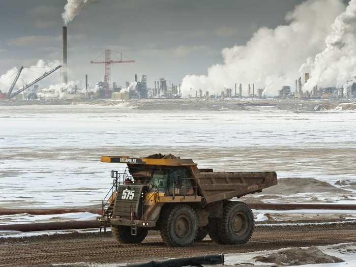 Massive haul trucks support surface mining operations in the tar sands region of Alberta, Canada, one of the largest known deposits of bitumen oil resources and one of the largest mining operations on Earth.