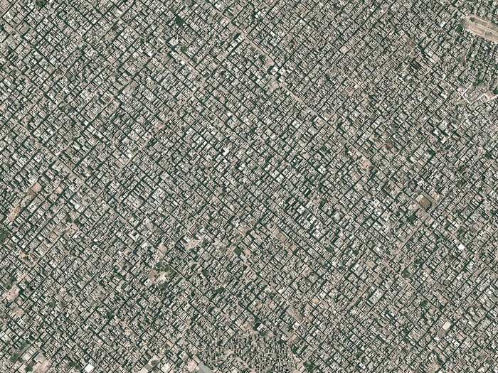 Aerial views of New Delhi, India, which has a population density of 30,000 people per square mile, show the sheer number of humans living on top of each other.