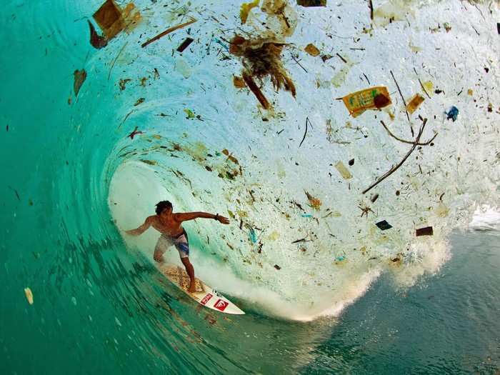 Indonesian surfer Dede Surinaya catches a wave in a remote but garbage-covered bay on Java, Indonesia, the world’s most populated island. Many places in the world have little or no trash collection infrastructure, so locals rid their waste either in the street or the water, where it eventually drifts out to sea.