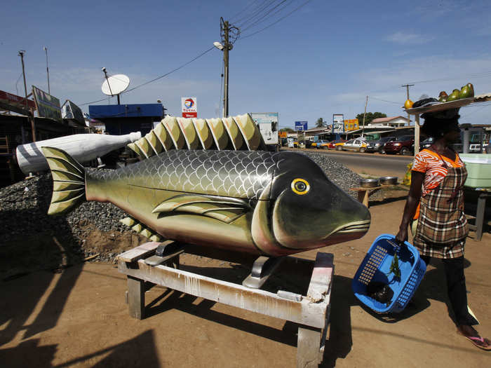 In Accra, Ghana, funerals are lavish events with untraditional coffins, such as this one in the shape of a fish.