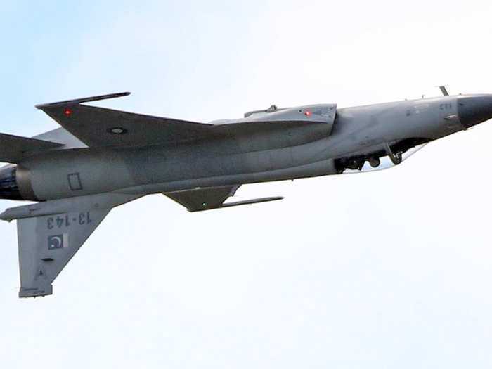 The JF-17 Thunder multi-role fighter, jointly developed by China and Pakistan, inverted for its demonstration flight.