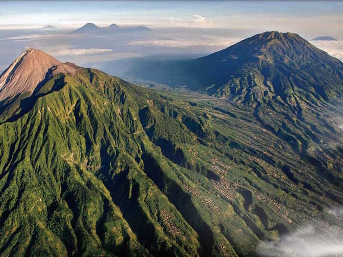 Mount Merapi, whose name in Indonesian means "fire mountain," is an active volcano bordering Central Java and Yogyakarta, Indonesia. The volcano, shown in this aerial photo, has erupted regularly since 1548, and most recently blew its top in March-April 2014.