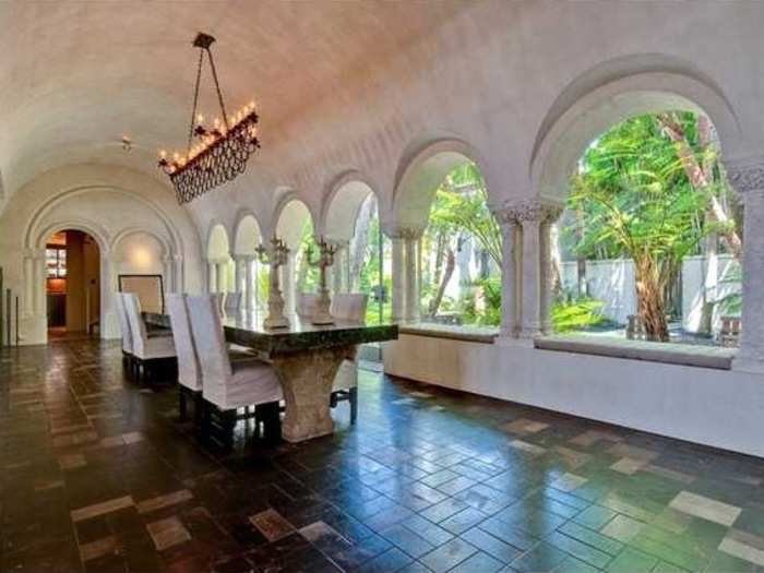 The dining room has lovely picture windows, giving guests a view of the courtyard.