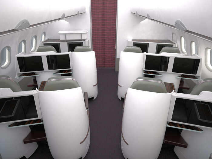 Business class seats look like cozy little pods.