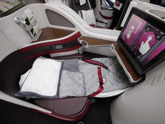 Some business class seats are extra wide and feature a 180-degree lie-flat bed.