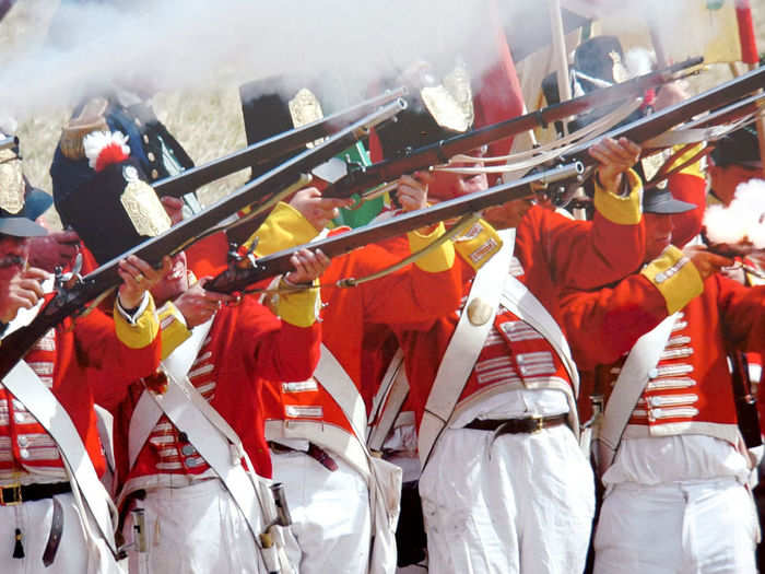 The muskets of the day were extremely inaccurate and slow to reload. To ensure an effective volley of fire, the troops stood in a line and fired all at once.