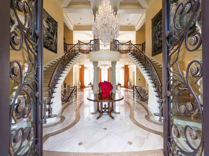 The lavish front entryway sets the tone for the rest of the seven bedroom home, which has nine full and five partial baths.