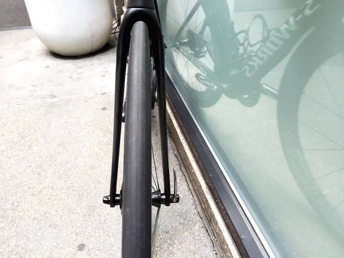 With the brake tucked behind the fork, things suddenly look a lot more aero up front.