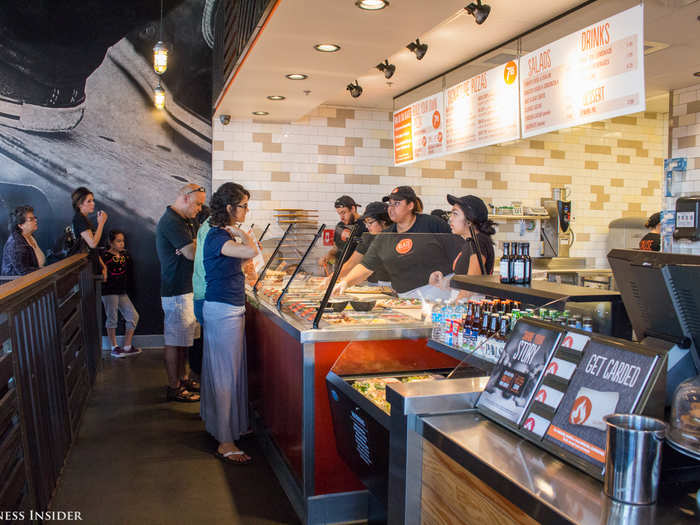 Like Chipotle, Blaze Pizza uses an assembly-style format that lets guests customize a "signature pizza" from the menu board or create their own.