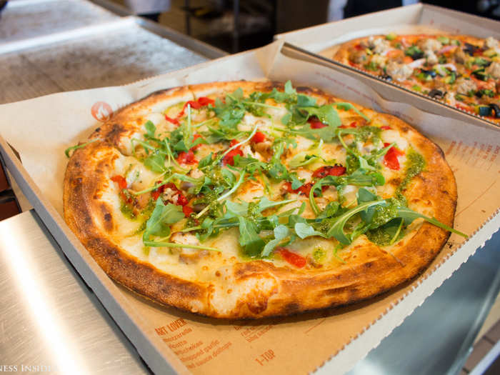 I liked it so much, that I ordered a second pie to bring home. The Green Stripe, a pesto-sauced pizza topped with grilled chicken, arugula, roasted red peppers, chopped garlic, and mozzarella, was delicious even reheated in my oven.