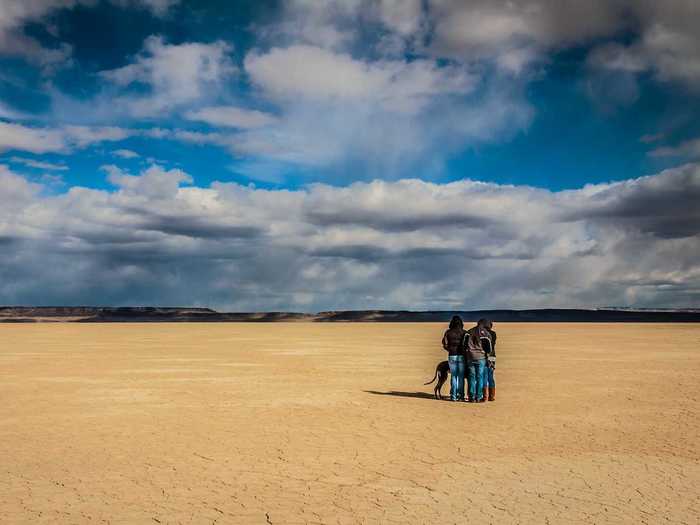 Alvord Desert, located in Harney County in southeastern Oregon, is a dry lake bed offering views of the majestic Steens Mountain and wilderness hiking trails. While parts of the area are privately owned, areas operated by the Bureau of Land Management are open for camping and explore the scenery as long as you come prepared with water, food, and equipment.