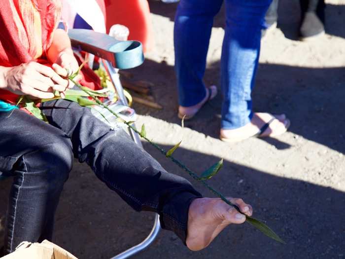 Others sat and braided leis out of leaves. One person offered to show me how to do it. I started one, but didn