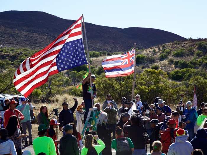 The protester on the ladder loudly declared TMT as yet another moment of foreign intrusion, where outsiders invade the native land and do as they please. (Most astronomers who work on Mauna Kea are not from Hawaii.)