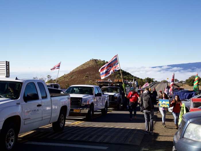 Protesters formed blocking lines on the road, stepped back a few feet, then repeated the process, over and over. As a result, the caravan moved at a snail