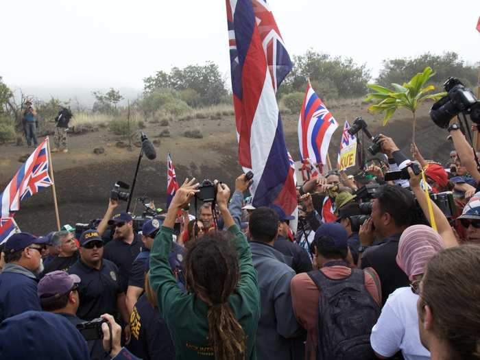 The officers issued a final warning: anyone blocking the road would now be arrested. Protesters could continue if they stuck to the sides of the path and didn