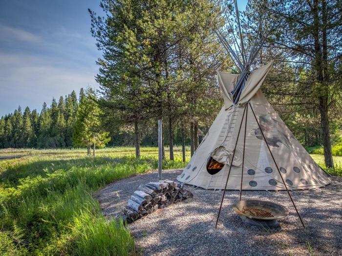 Cross a small wooden bridge and enter a private island with a furnished tepee.