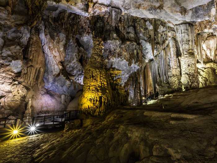 Vietnam’s Phong Nha-Ke Bang National Park, located in the middle of the Annamite Mountain Range in the Quang Binh province, is home to the oldest karst (or landscapes formed from soluble rocks and characterized by caves and sinkholes) formations in Asia. Dating back over 400 million years, it contains over 104 km (64 miles) of caves and underground rivers.