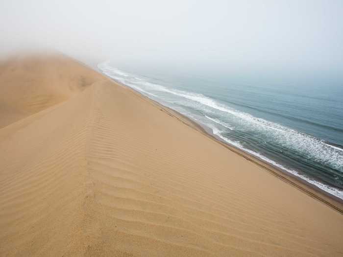 The Namib Sand Sea, located on the African coast of Namibia’s Namid-Naukluft Park, is the only coastal desert in the world, whose dune fields often come into contact with fog and have created a unique array of wildlife that has evolved to adopt to the environment. The landscape includes everything from rocky hills to coastal lagoons.