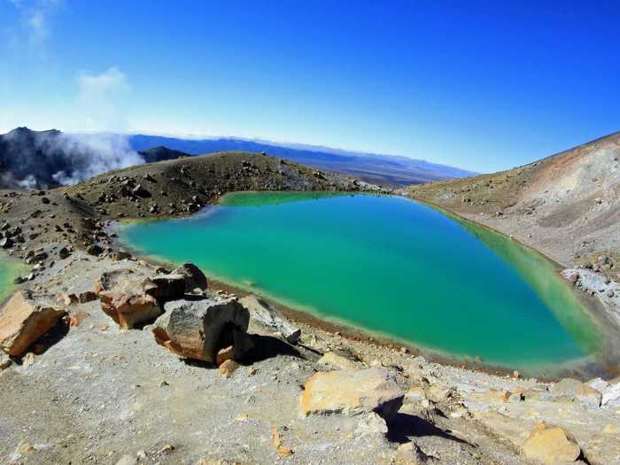 Tongariro National Park, on the North Island in New Zealand, is the oldest national park in the country and is home to magnificent green lakes whose colors are the result of volcanic minerals in the water.