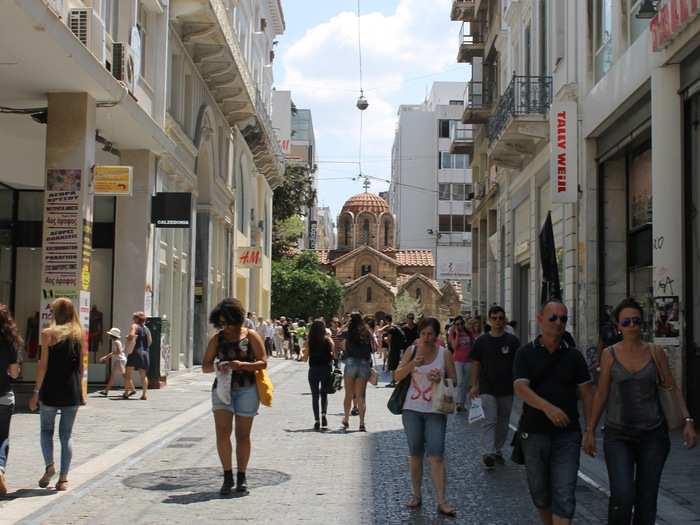 The Church of Panagia Kapnikarea is in the middle of the street — it