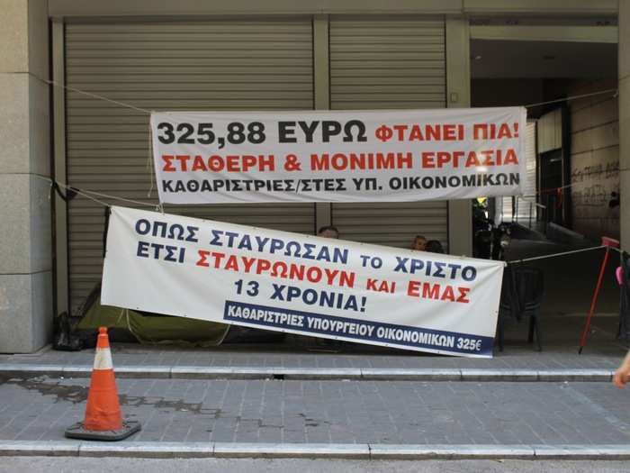 On a side-street at the very eastern end of Ermou, I saw cleaners protesting against low wages.